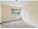 Bedroom with neutral walls, carpet, and a window view of the outdoors at 2444 S Brandywine Ct, Greenfield, IN 46140