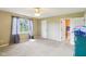 Spacious bedroom with carpet flooring, ceiling fan and view to the bathroom in a home for sale at 2444 S Brandywine Ct, Greenfield, IN 46140