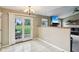Bright dining area showcasing sliding glass doors with views of the spacious backyard and outdoor seating at 2444 S Brandywine Ct, Greenfield, IN 46140
