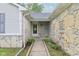 Charming front entryway featuring stone accents, a cozy covered porch, and a well-maintained walkway at 2444 S Brandywine Ct, Greenfield, IN 46140