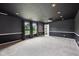 Finished basement with recessed lighting, dark walls, two windows, and gray carpeting at 2545 Harvest Moon Dr, Greenwood, IN 46143