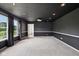 Finished basement with recessed lighting, a drop ceiling, dark walls, gray carpet, and one window at 2545 Harvest Moon Dr, Greenwood, IN 46143
