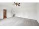 Bright bedroom with a ceiling fan and neutral walls that leads to the bathroom at 2545 Harvest Moon Dr, Greenwood, IN 46143