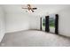 Bright bedroom with a ceiling fan and two windows dressed with dark, elegant drapes at 2545 Harvest Moon Dr, Greenwood, IN 46143