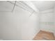 Walk-in closet offers ample storage with white wire shelving and laminate flooring at 2545 Harvest Moon Dr, Greenwood, IN 46143