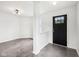 Bright entryway featuring polished concrete floors, modern lighting, and a freshly painted black door at 2545 Harvest Moon Dr, Greenwood, IN 46143