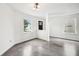 Bright, freshly painted living room features concrete floors and large windows at 2545 Harvest Moon Dr, Greenwood, IN 46143