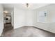 Bright living room featuring a window and neutral walls, leading to an adjacent room with kitchen view at 2545 Harvest Moon Dr, Greenwood, IN 46143