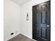 Mud room with a dark, five-paneled door, white trim, and convenient wall features at 2545 Harvest Moon Dr, Greenwood, IN 46143