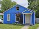 Charming blue bungalow featuring a cozy front entrance and well-maintained lawn at 2737 S Roena St, Indianapolis, IN 46241