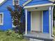 Charming blue house featuring a welcoming front entrance and nicely landscaped garden at 2737 S Roena St, Indianapolis, IN 46241