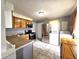 Kitchen with stainless steel appliances, light wood cabinets, and washer/dryer hookups at 2737 S Roena St, Indianapolis, IN 46241