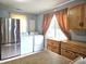 Bright kitchen with updated stainless steel refrigerator, and newer appliances at 2737 S Roena St, Indianapolis, IN 46241