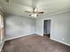 Cozy living room featuring neutral carpet, fan, and access to other rooms at 2737 S Roena St, Indianapolis, IN 46241