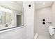 Clean bathroom with gray tiles, a glass shower, and matte black fixtures at 3873 Goodwin Dr, Zionsville, IN 46077
