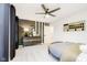 Bedroom featuring a baseball scoreboard, an accent wall, and large windows at 3873 Goodwin Dr, Zionsville, IN 46077