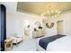 Bright bedroom featuring a decorative chandelier, a neutral palette, and an en suite bathroom at 3873 Goodwin Dr, Zionsville, IN 46077