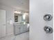 Bathroom featuring double sink vanity, granite countertops and shower at 3907 Goodwin Dr, Zionsville, IN 46077