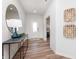 Bright entryway with console table, decorative mirror, and view to front door at 3907 Goodwin Dr, Zionsville, IN 46077