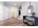 Functional entryway featuring coat rack, storage bench, and decorative mirror at 3907 Goodwin Dr, Zionsville, IN 46077