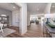 Hallway view into a stylish open-concept living space with natural light and modern decor at 3907 Goodwin Dr, Zionsville, IN 46077