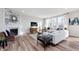 Bright living room with fireplace, wood floors, large windows, and stylish furniture at 3907 Goodwin Dr, Zionsville, IN 46077