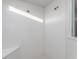 All-white shower features white subway tiles, a bench and dual shower heads at 3907 Goodwin Dr, Zionsville, IN 46077
