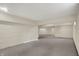 Spacious finished basement with carpeting and painted brick foundation walls at 3996 Brockton Manor N Dr, Greenwood, IN 46143