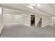 Large finished basement with neutral walls and flooring, plus access to the stairway at 3996 Brockton Manor N Dr, Greenwood, IN 46143