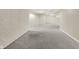 Unfinished basement area featuring painted brick walls and carpeted floors at 3996 Brockton Manor N Dr, Greenwood, IN 46143