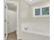 Bright bathroom featuring a modern tub and a separate shower room at 3996 Brockton Manor N Dr, Greenwood, IN 46143
