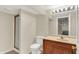 Bathroom with a vanity, toilet, shower with a glass enclosure and neutral wall color at 3996 Brockton Manor N Dr, Greenwood, IN 46143