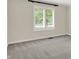View of a bedroom with a window with white shutters, providing natural light and view at 3996 Brockton Manor N Dr, Greenwood, IN 46143