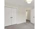 Bedroom featuring double closets and neutral carpet at 3996 Brockton Manor N Dr, Greenwood, IN 46143