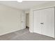 Cozy bedroom features neutral walls, soft carpet, and ample closet space at 3996 Brockton Manor N Dr, Greenwood, IN 46143