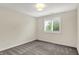 Bright bedroom with large window with shutter, carpet flooring and light-colored walls at 3996 Brockton Manor N Dr, Greenwood, IN 46143