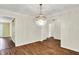 Bright dining room featuring hardwood floors and a decorative chandelier at 3996 Brockton Manor N Dr, Greenwood, IN 46143