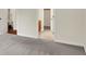 Bright hallway showcasing doorways leading to various rooms, creating an open feel at 3996 Brockton Manor N Dr, Greenwood, IN 46143