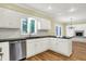 Well-appointed kitchen featuring white cabinets, black counters, and stainless steel appliances at 3996 Brockton Manor N Dr, Greenwood, IN 46143