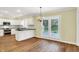 Bright kitchen featuring stainless steel appliances, white cabinets and backsplash, and plenty of natural light at 3996 Brockton Manor N Dr, Greenwood, IN 46143