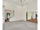 Bright living room with staircase, chandelier, and view of adjacent rooms at 3996 Brockton Manor N Dr, Greenwood, IN 46143