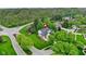 This home is located in a lush, green neighborhood with beautiful landscaping and mature trees at 3996 Brockton Manor N Dr, Greenwood, IN 46143