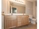 This bathroom features a dual vanity with a white countertop and a toilet at 4104 Bullfinch Way, Westfield, IN 46062