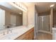 This is a large bathroom with double sinks, large mirror, shower, and toilet at 4104 Bullfinch Way, Westfield, IN 46062