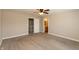 This carpeted bedroom has a ceiling fan and doors leading to another room and a bathroom at 4104 Bullfinch Way, Westfield, IN 46062