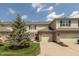 Brick and vinyl townhome features a garage, front yard, and nice landscaping at 4104 Bullfinch Way, Westfield, IN 46062