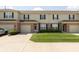 A home's exterior showcases its well-manicured lawn, attached garages, and classic architectural style at 4104 Bullfinch Way, Westfield, IN 46062