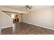 A bright living room features wood floors and an open floorplan that flows into the kitchen area at 4104 Bullfinch Way, Westfield, IN 46062