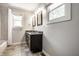 Bathroom featuring double sinks, granite countertops, tile floors and combination tub/shower at 413 E 40Th St, Indianapolis, IN 46205