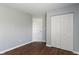 This bedroom has wood floors, neutral walls, a closet with bi-fold doors and white trim at 4136 Orchard Valley Ln, Indianapolis, IN 46235
